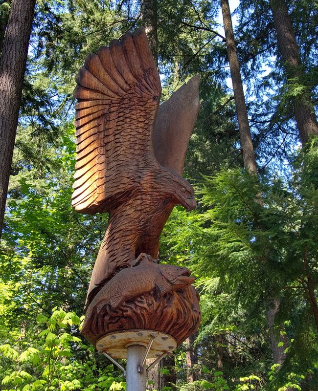 Wooden eagle with fish