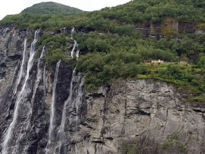 Waterfalls and some houses on top of the cliffs