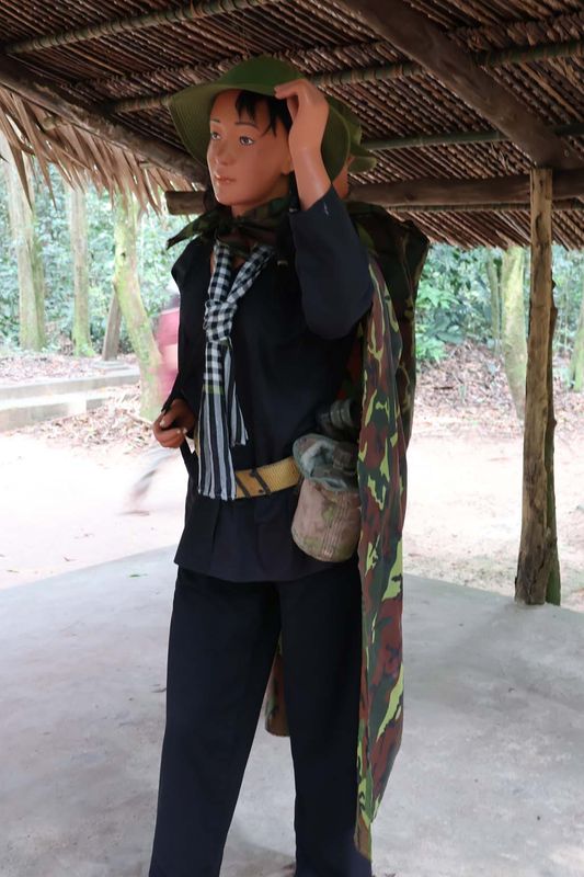 VIET CONG WORE CLOTHES SIMILAR TO FARMERS BUT COULD BE IDENTIFIED BY THE KNOT IN THEIR SCARF