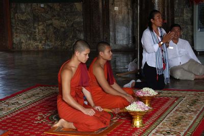 MONKS BLESS OUR GROUPS THEN THROW LOTUS BLOSSOMS ON US
