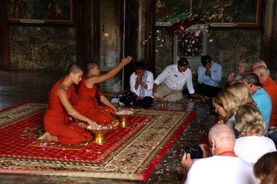 MONKS BLESS OUR GROUPS THEN THROW LOTUS BLOSSOMS ON US