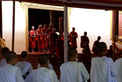 MONKS FEEDING THE ELDERLY AND DISABLED