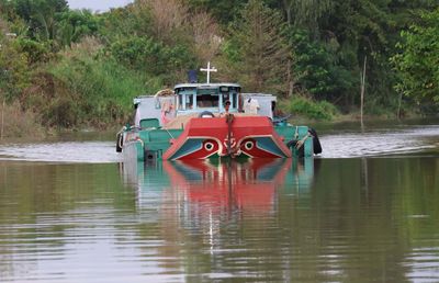 SAND FROM THE MEKONG BEING BARGED