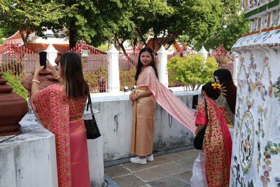 YOUNG GIRLS LIKE TO RENT FANCY DRESSES AND BE PHOTOGRAPHED IN THE TEMPLE