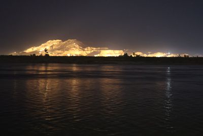 THE HILLS TO THE WEST ARE LIT AT NIGHT