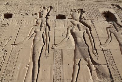 ONLY KNOWN CARVING OF CLEOPATRA (L) WITH THE GODDESS HATHOR BEHIND HER