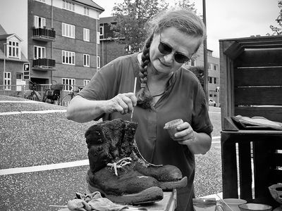 Artist painting boots