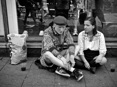 A smoke and a drink on the sidewalk