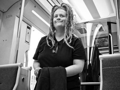 Smiling light rail passenger