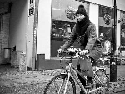 Hat lady on bike