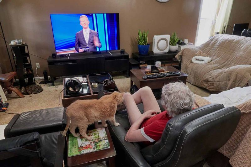 Sylvester and I watching Jeopardy.       IMG_3170.jpg