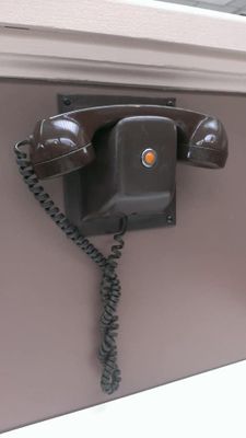 The table phone you used to place your order at Round The Corner restaurant. Gourmet hamburgers!
