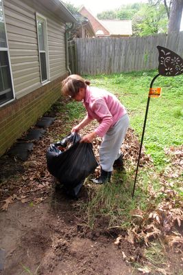 Glo doing some yard work.             IMG_2673.jpg