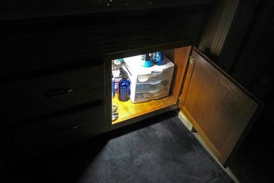 Put a handy remote controlled light in this cabinet.         IMG_3623.jpg
