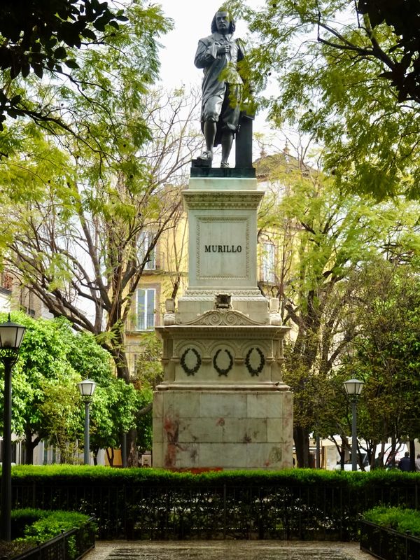 Leafy plaza with statue of Murillo, Spanish artist