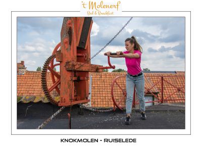 Yana turning the windmill in the wind direction