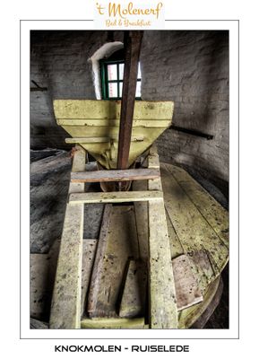 View on the hopper and Iron spindle that drives the runner stone.