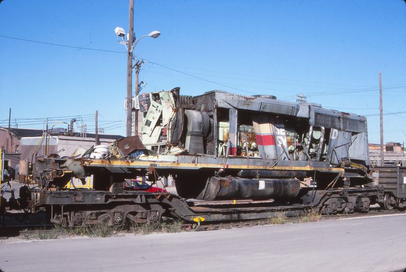 L&N depressed centerr flat 4997 with wrecked SBD paint CSX GP38, Oak Street Yard on the P&L.jpg