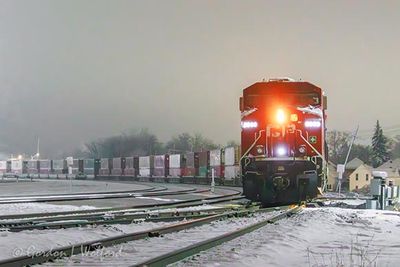 Westbound CPKC Freight Train Arriving At Night 90D95718