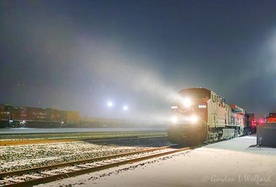 Westbound Freight Train On A Snowy Night 90D97432