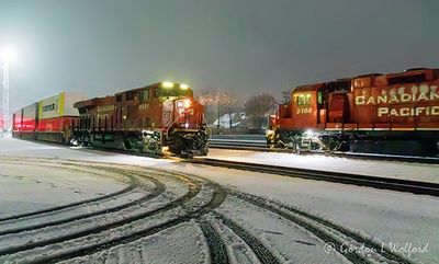 Eastbound & Westbound Trains Passing At Night 90D107402