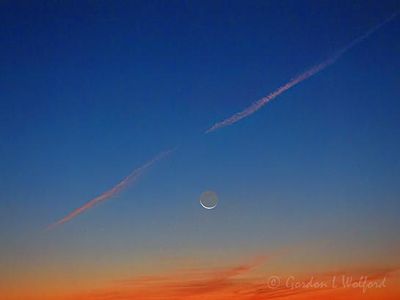 Crescent Moon Beyond Contrail At Dawn DSCN012130
