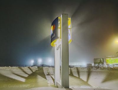 VIA Rail Station Sign On A Foggy Night 90D134631-5