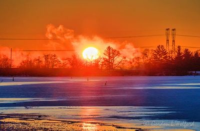 Sun Rising Beyond Steam Fog 90D137065
