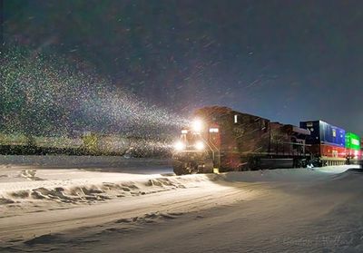 CPKC Westbound Freight Train In Night Snow 90D143213