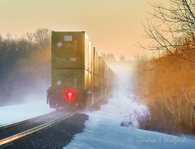 Eastbound CPKC Freight Train Kicking Up Snow 90D145592