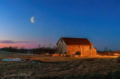 Moon Beyond Barn At Dawn 90D147478