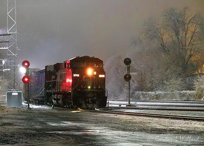 Eastbound CPKC Train On A Snowy Night 90D149689