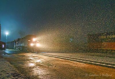 Eastbound CPKC Train On A Snowy Night 90D149773