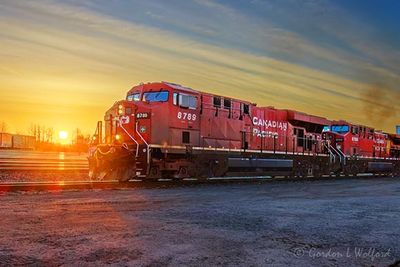Westbound CPKC Train At Sunrise 90D151275