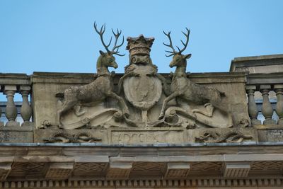 Stags on the roof top of Buxton Crescent