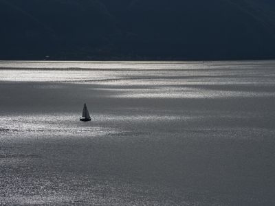 Sailing boat on a silver Lake Geneva