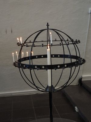 Tromsų Arctic Cathedral - candle stand reminiscent of the globe erected on the Polar Circle