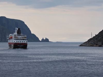 Finnkjerka rock formation with Hurtigruten Kong Harald