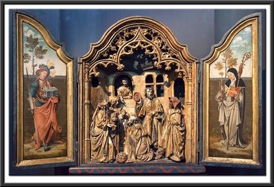 Domestic altar with the Adoration of the Magi and Saints Clare and Adrian in the wings. C1515 - 1520