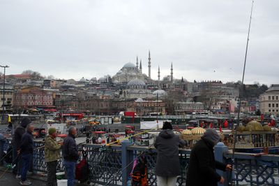 Fishermen, Rustem Pasa Mosque at the background