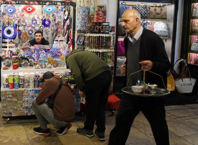 Man carrying tea tray at the  GRAND BAZAR