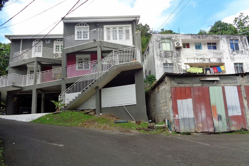 034 So Often a Repaired Home is next to one in poor condition.jpg