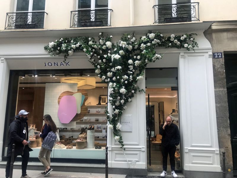 010 A Trend of Putting Crepe Paper Flowers on Shops and Restaurants.jpg