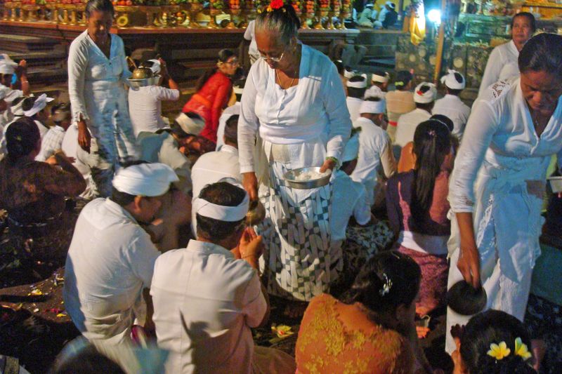 076 Temple Ladies Dispense Rice and Holy Water.jpg