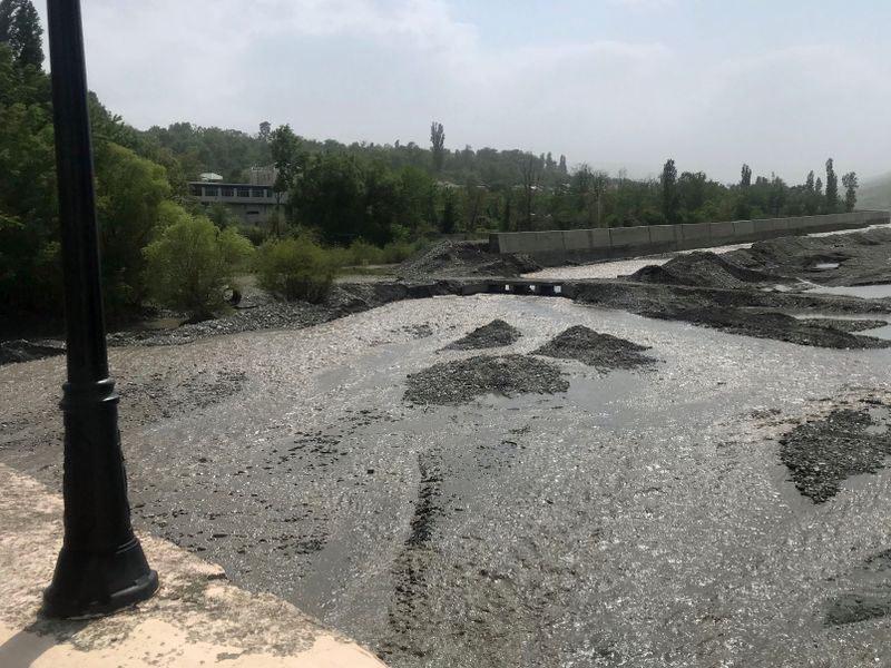 098 Crossing the River to Red Town- water is gray with snow melt.jpg