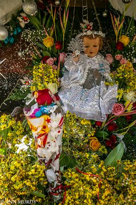 Niño Jesus in white lace gown
