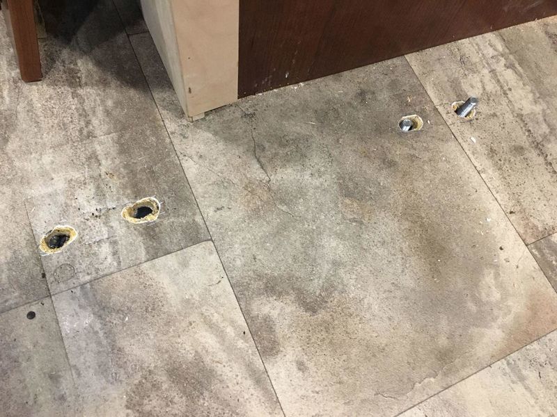Holes in floor from seatbelt bracket