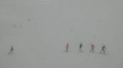 Skiers heading for the train in whiteout nearing Myrdal
