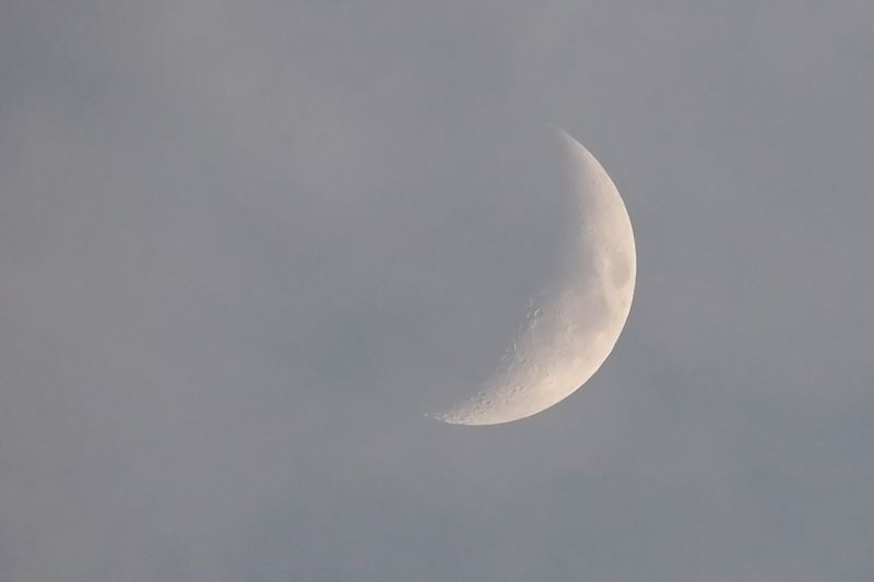 Crescent in the Clouds