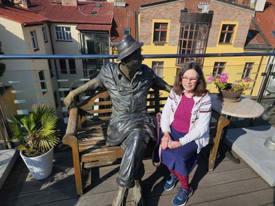Mary sits with a friend on the Rooftop Terrace